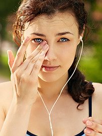 Patient with red, irritated eyes from dry eye disease